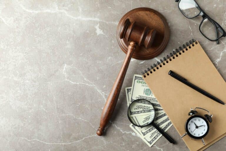 lawyer's gavel, clock, agenda and money to track billable hours
