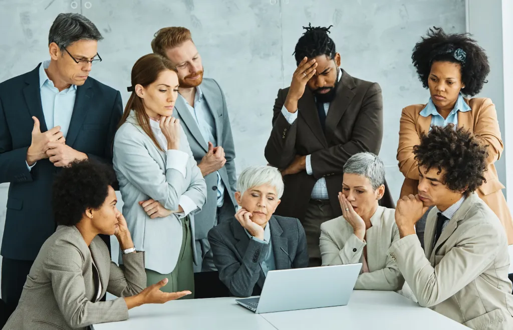 A team of nine people stressed at work
